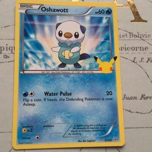 Oshawott, non holographic Pokémon card.